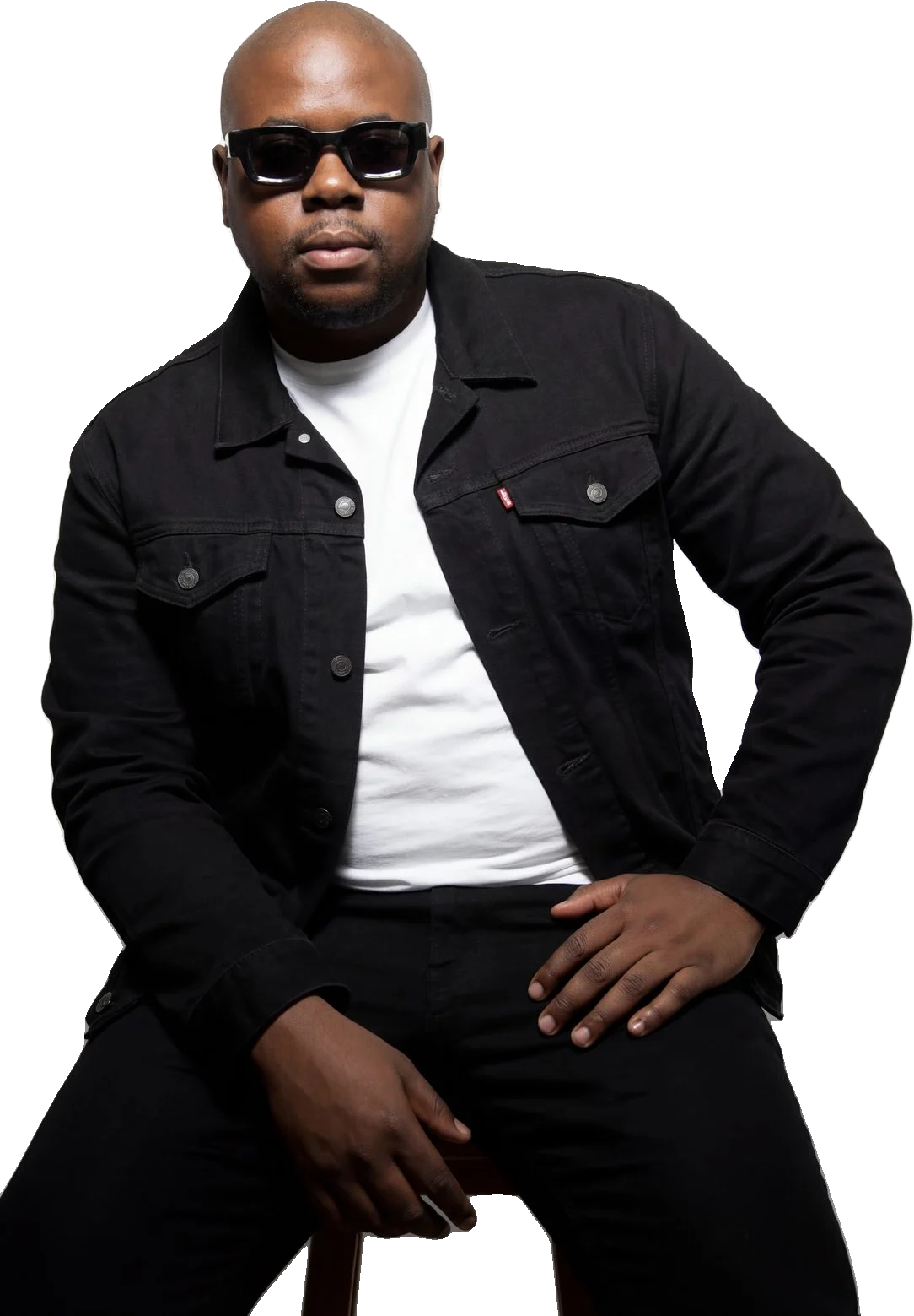 Sandile Mthukwane in a black denim jacket and sunglasses